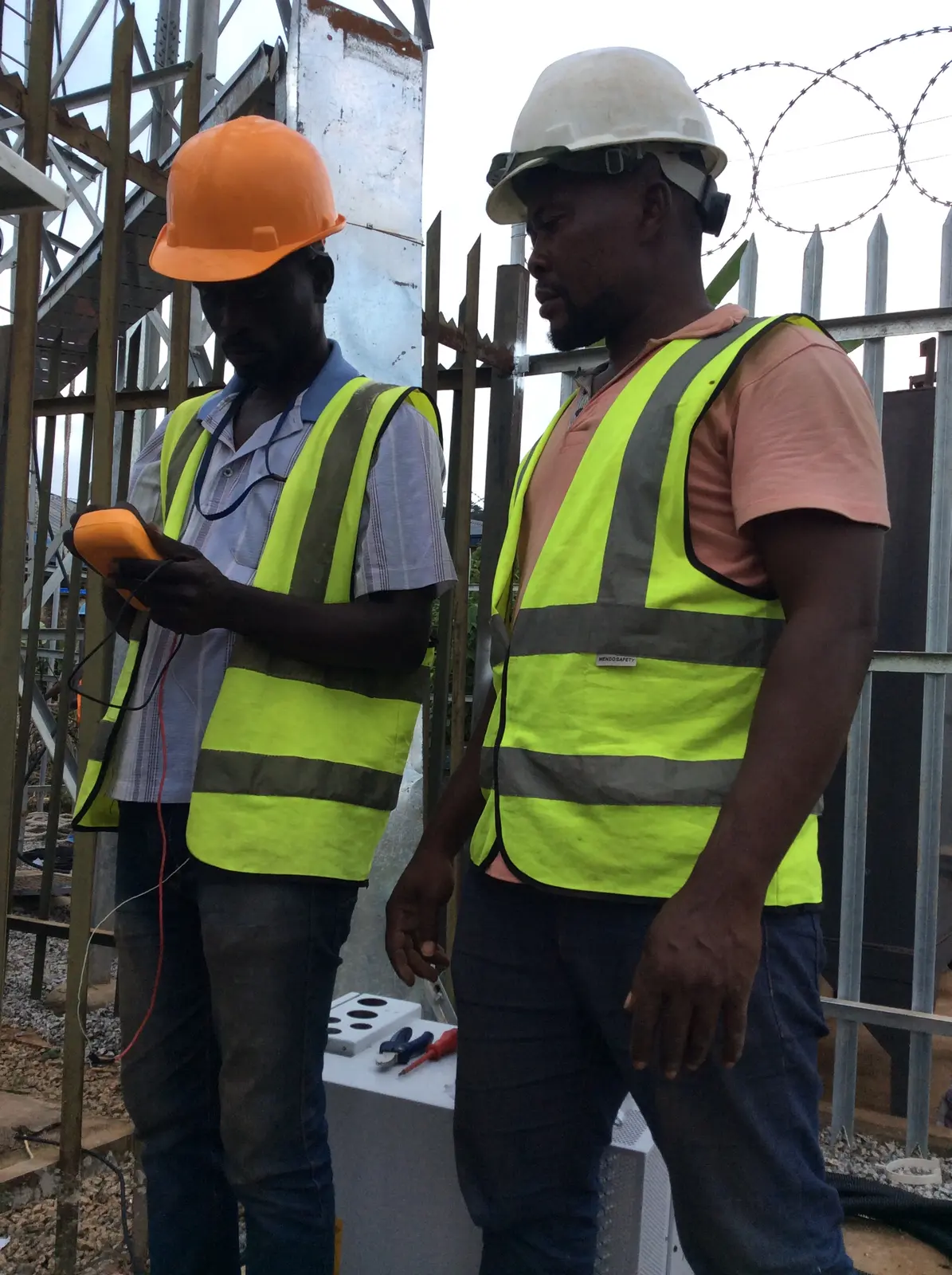 Kudos engineers wearing safety equipment at a project site