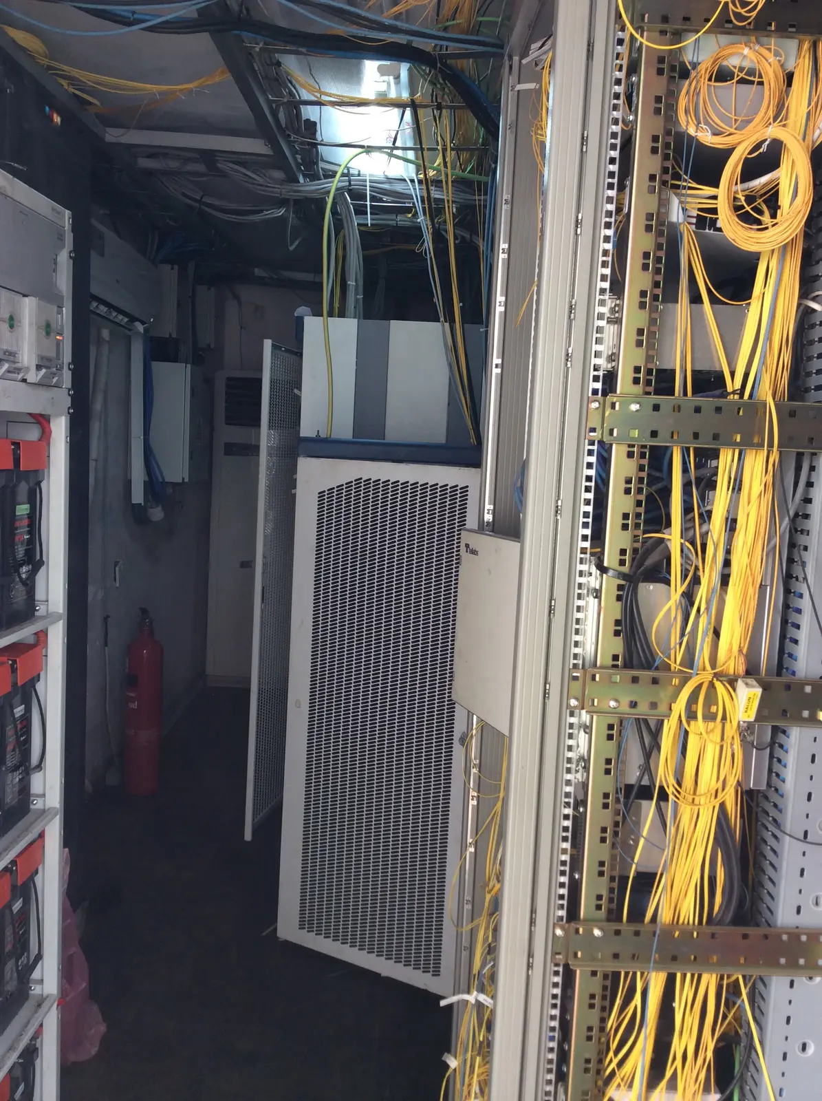 Telecommunications equipment cabinet installed in a network facility