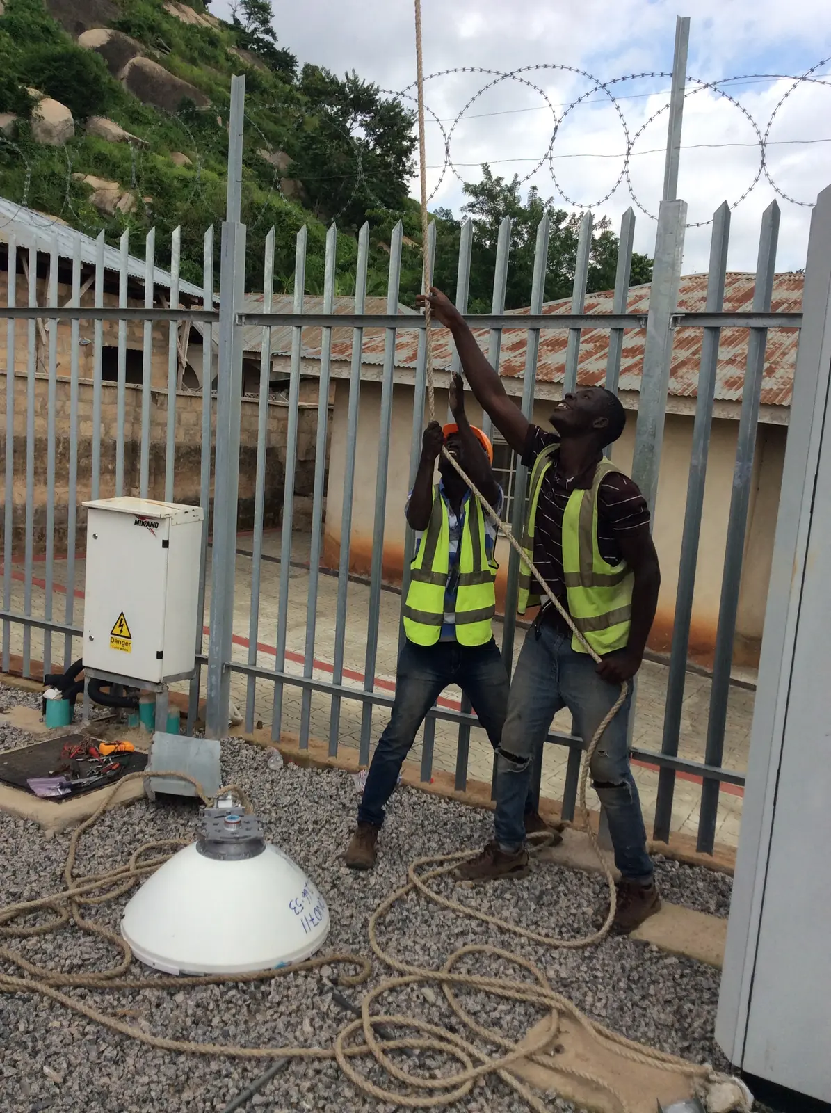 Field engineers coordinating work at a telecommunications site
