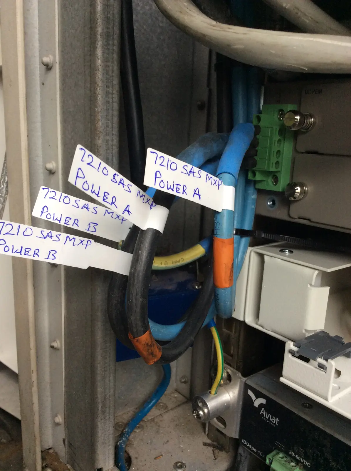 Clearly labelled power cables inside telecommunications equipment
