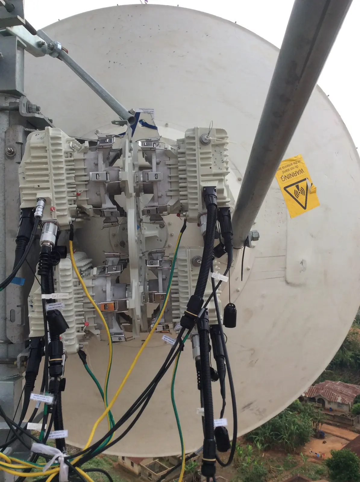 Outdoor radio transmission units installed beside a satellite dish