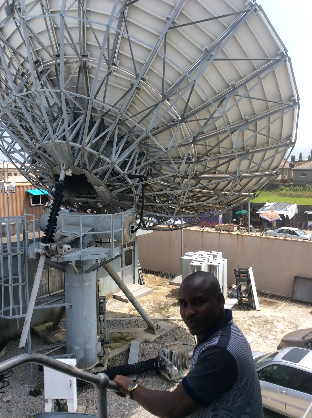 Large satellite communications antenna at a project site