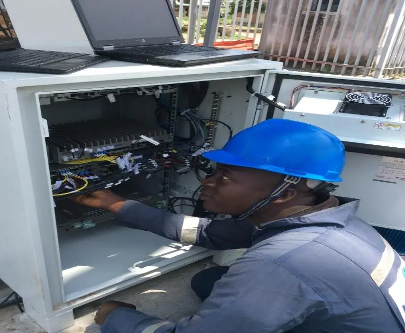 Kudos network engineer working on equipment